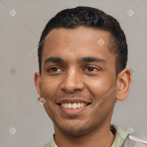 Joyful latino young-adult male with short  black hair and brown eyes