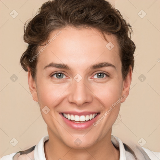 Joyful white young-adult female with short  brown hair and grey eyes