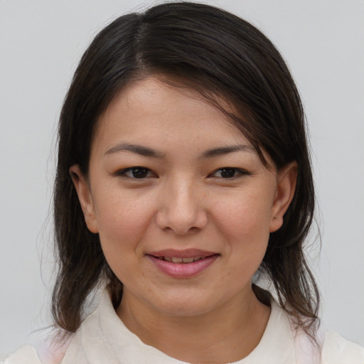 Joyful white young-adult female with medium  brown hair and brown eyes