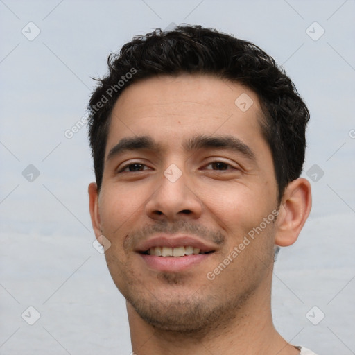 Joyful white young-adult male with short  black hair and brown eyes