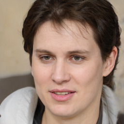 Joyful white adult female with medium  brown hair and brown eyes