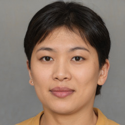 Joyful asian young-adult female with short  brown hair and brown eyes