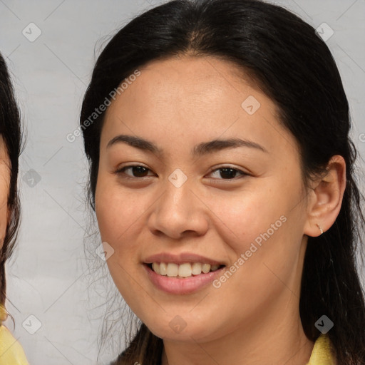 Joyful latino young-adult female with medium  brown hair and brown eyes