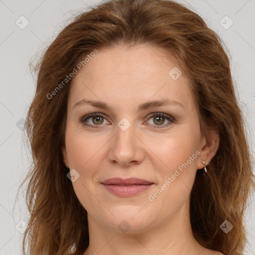 Joyful white young-adult female with long  brown hair and green eyes