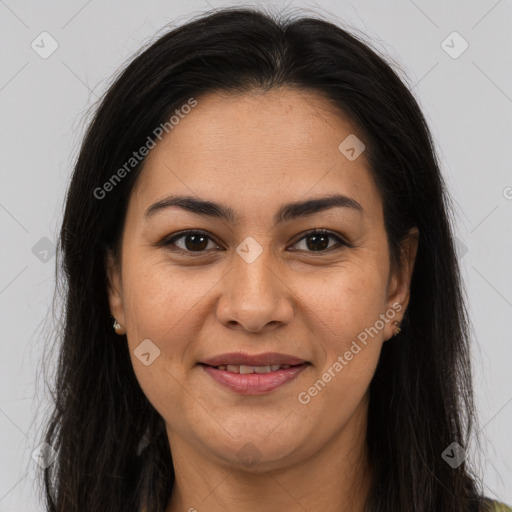 Joyful latino young-adult female with long  brown hair and brown eyes