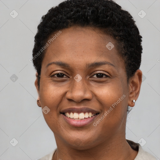 Joyful black young-adult female with short  brown hair and brown eyes