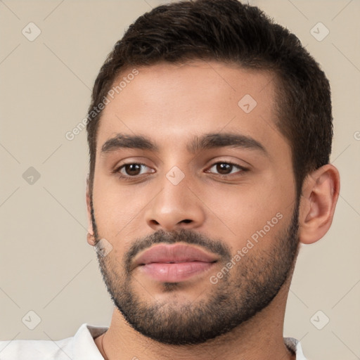 Neutral white young-adult male with short  brown hair and brown eyes