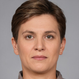 Joyful white adult female with short  brown hair and grey eyes