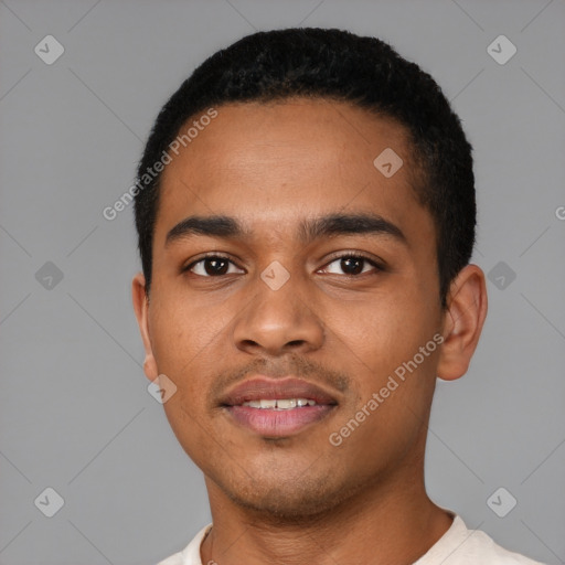 Joyful latino young-adult male with short  black hair and brown eyes