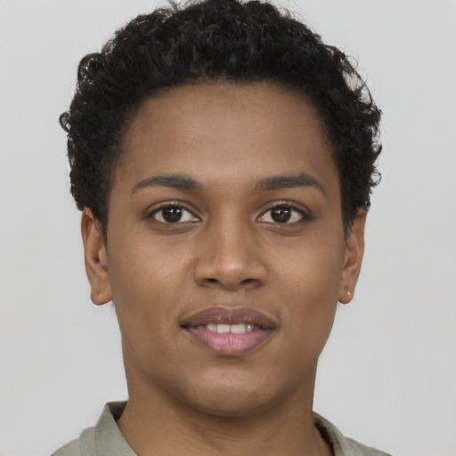 Joyful black young-adult female with short  brown hair and brown eyes