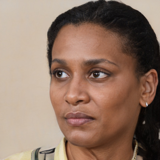 Neutral black young-adult female with short  black hair and brown eyes