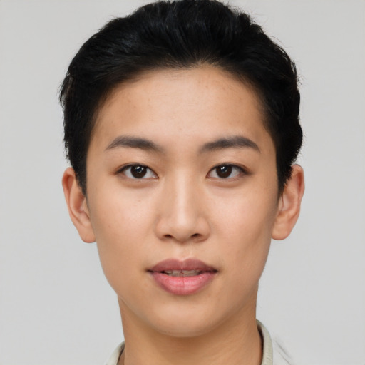 Joyful asian young-adult female with short  black hair and brown eyes