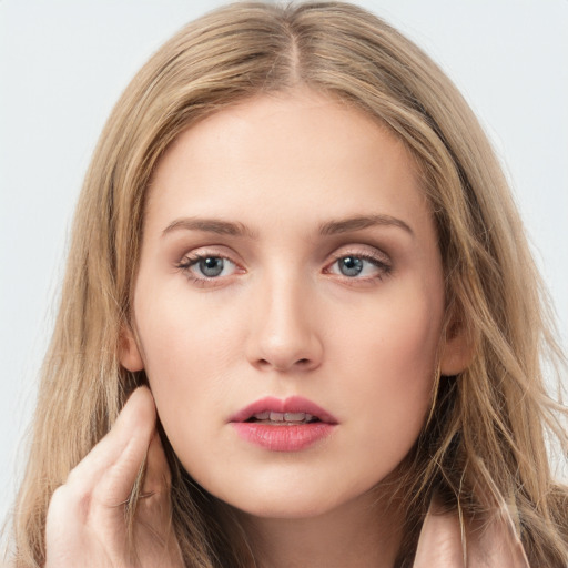 Neutral white young-adult female with long  brown hair and grey eyes