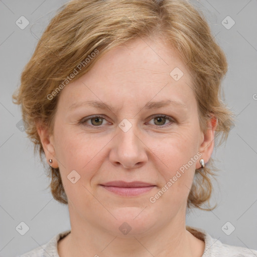 Joyful white adult female with medium  brown hair and blue eyes