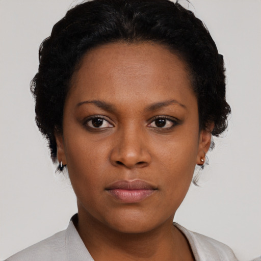 Neutral black young-adult female with short  black hair and brown eyes