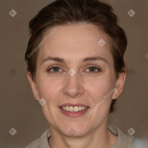 Joyful white adult female with short  brown hair and brown eyes