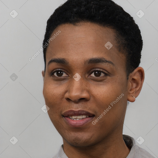 Joyful black young-adult female with short  black hair and brown eyes