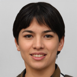 Joyful asian young-adult female with short  brown hair and brown eyes