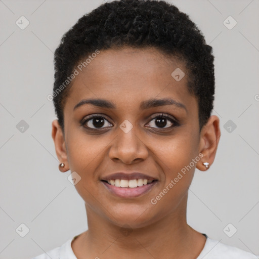 Joyful black young-adult female with short  black hair and brown eyes