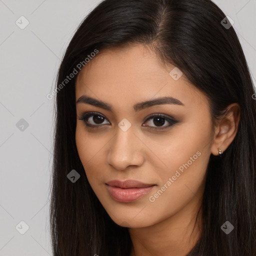 Joyful latino young-adult female with long  brown hair and brown eyes