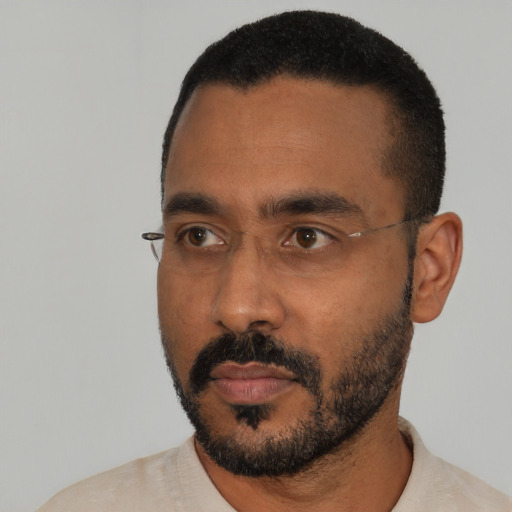 Neutral black young-adult male with short  black hair and brown eyes