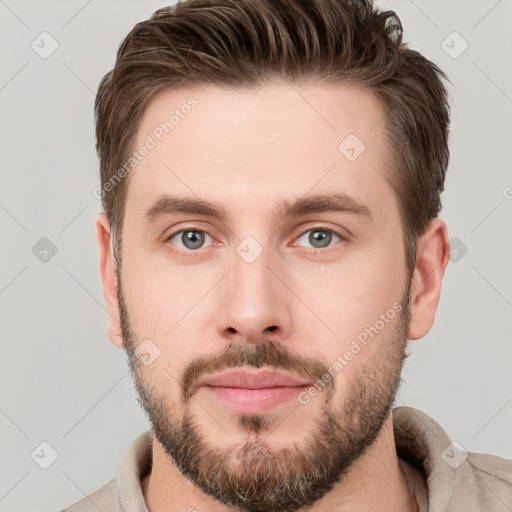 Neutral white young-adult male with short  brown hair and grey eyes