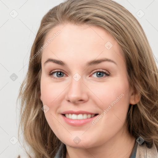 Joyful white young-adult female with long  brown hair and blue eyes