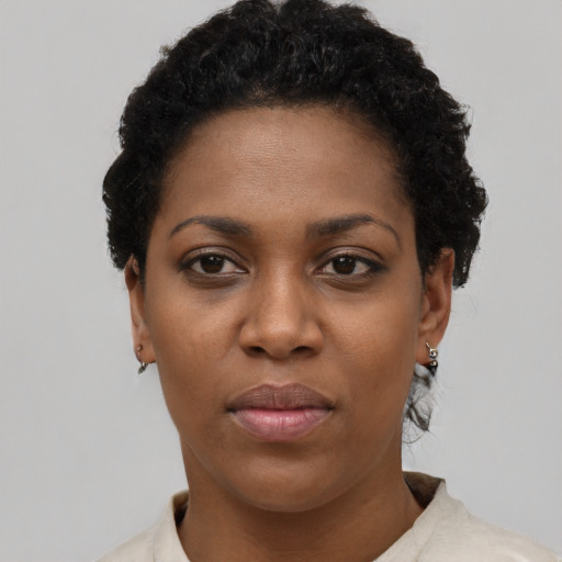 Neutral black young-adult female with short  black hair and brown eyes