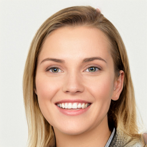 Joyful white young-adult female with medium  brown hair and blue eyes