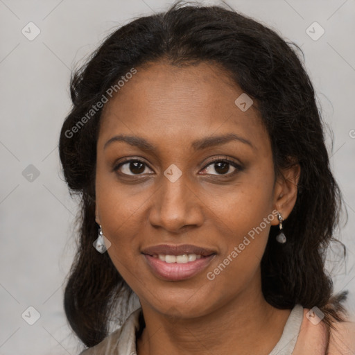 Joyful black adult female with medium  brown hair and brown eyes