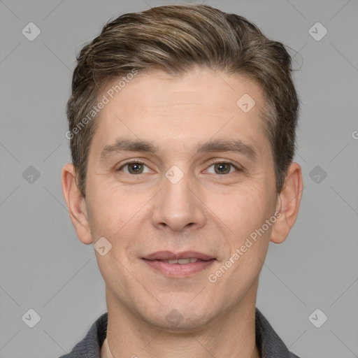 Joyful white adult male with short  brown hair and grey eyes