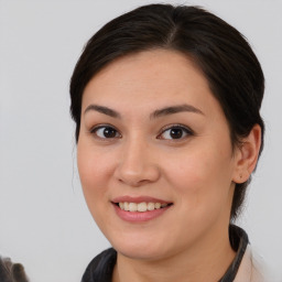 Joyful white young-adult female with medium  brown hair and brown eyes