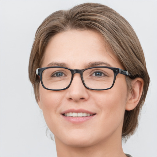 Joyful white young-adult female with medium  brown hair and blue eyes