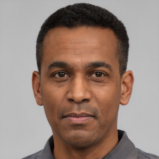 Neutral latino adult male with short  black hair and brown eyes