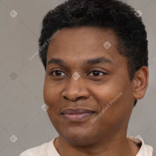 Joyful black young-adult male with short  black hair and brown eyes