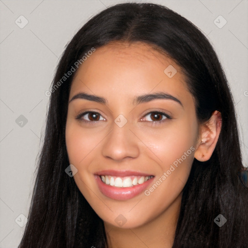 Joyful latino young-adult female with long  black hair and brown eyes