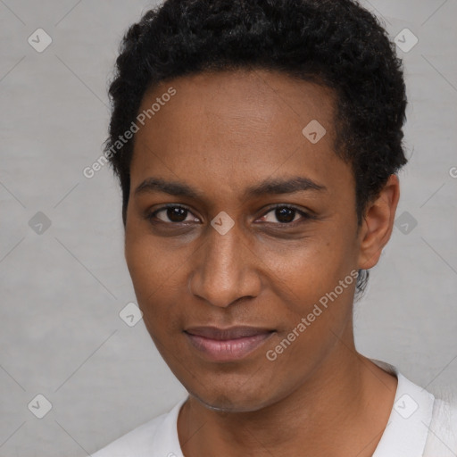 Joyful black young-adult female with short  brown hair and brown eyes