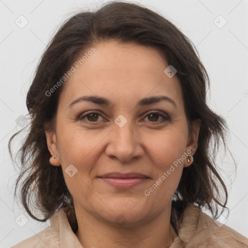 Joyful white adult female with medium  brown hair and brown eyes