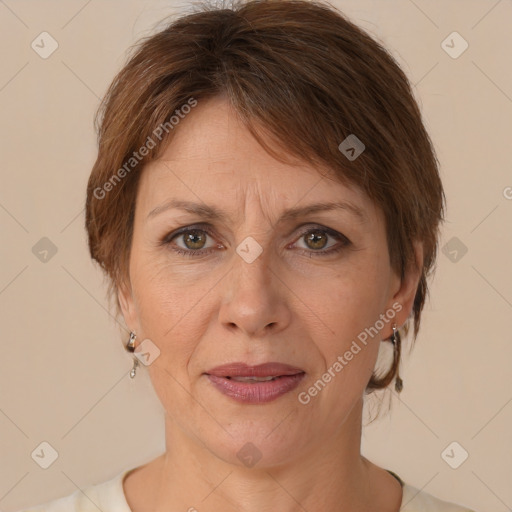 Joyful white adult female with medium  brown hair and brown eyes