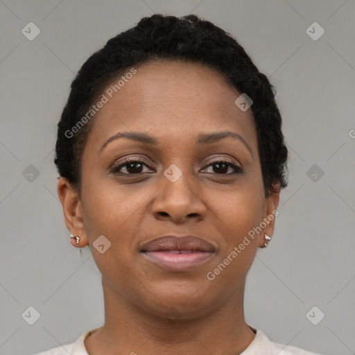 Joyful black young-adult female with short  brown hair and brown eyes