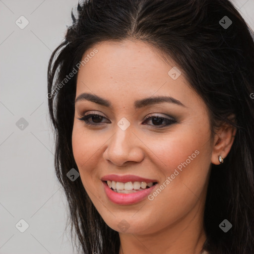 Joyful white young-adult female with long  brown hair and brown eyes