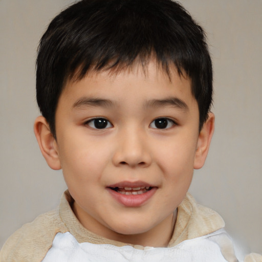 Joyful white child male with short  brown hair and brown eyes