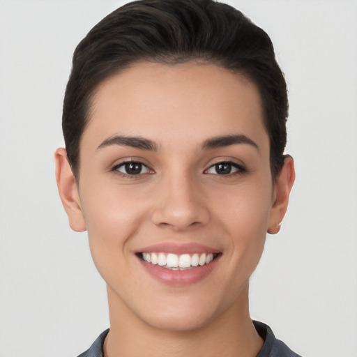 Joyful white young-adult female with short  brown hair and brown eyes