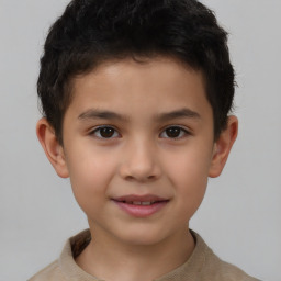 Joyful white child male with short  brown hair and brown eyes