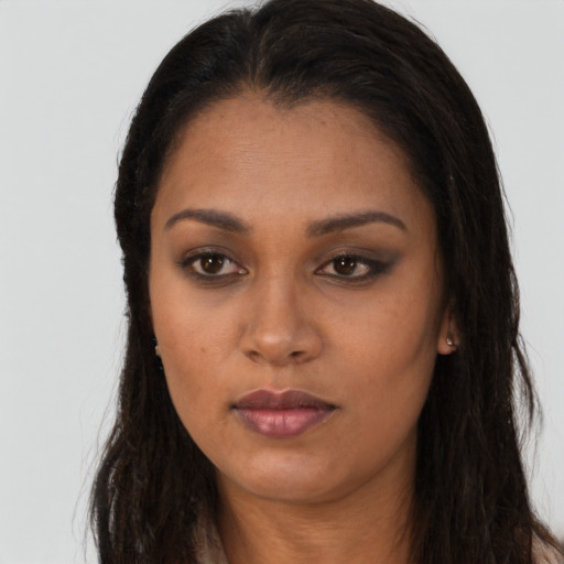 Neutral latino young-adult female with long  brown hair and brown eyes