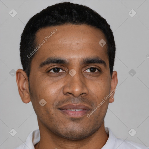 Joyful black young-adult male with short  black hair and brown eyes