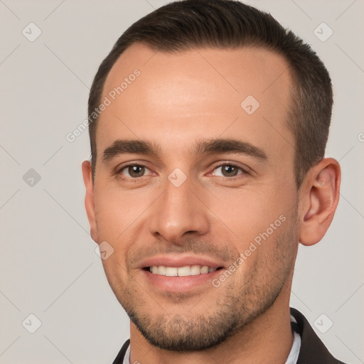 Joyful white young-adult male with short  brown hair and brown eyes