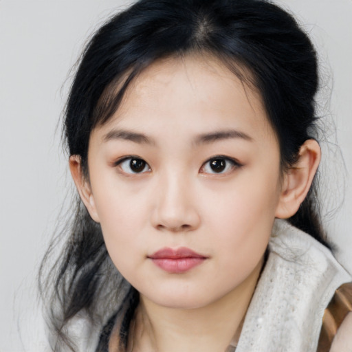 Neutral asian child female with medium  brown hair and brown eyes