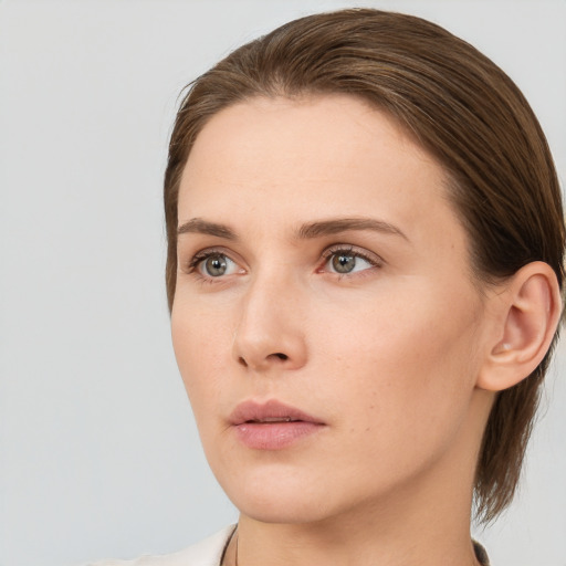 Neutral white young-adult female with medium  brown hair and grey eyes