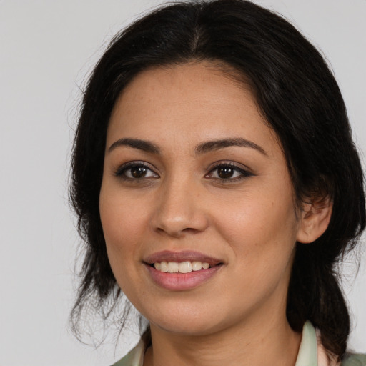 Joyful white young-adult female with medium  brown hair and brown eyes